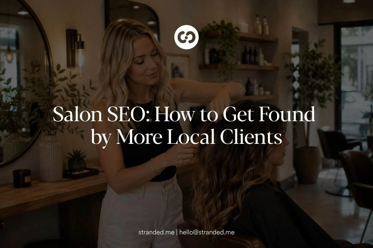 Modern hair salon with stylists working with clients in a bright, upscale interior.