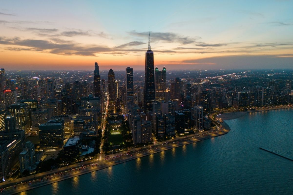 Chicago skyline beside Lake Michigan at dusk for plastic surgery marketing